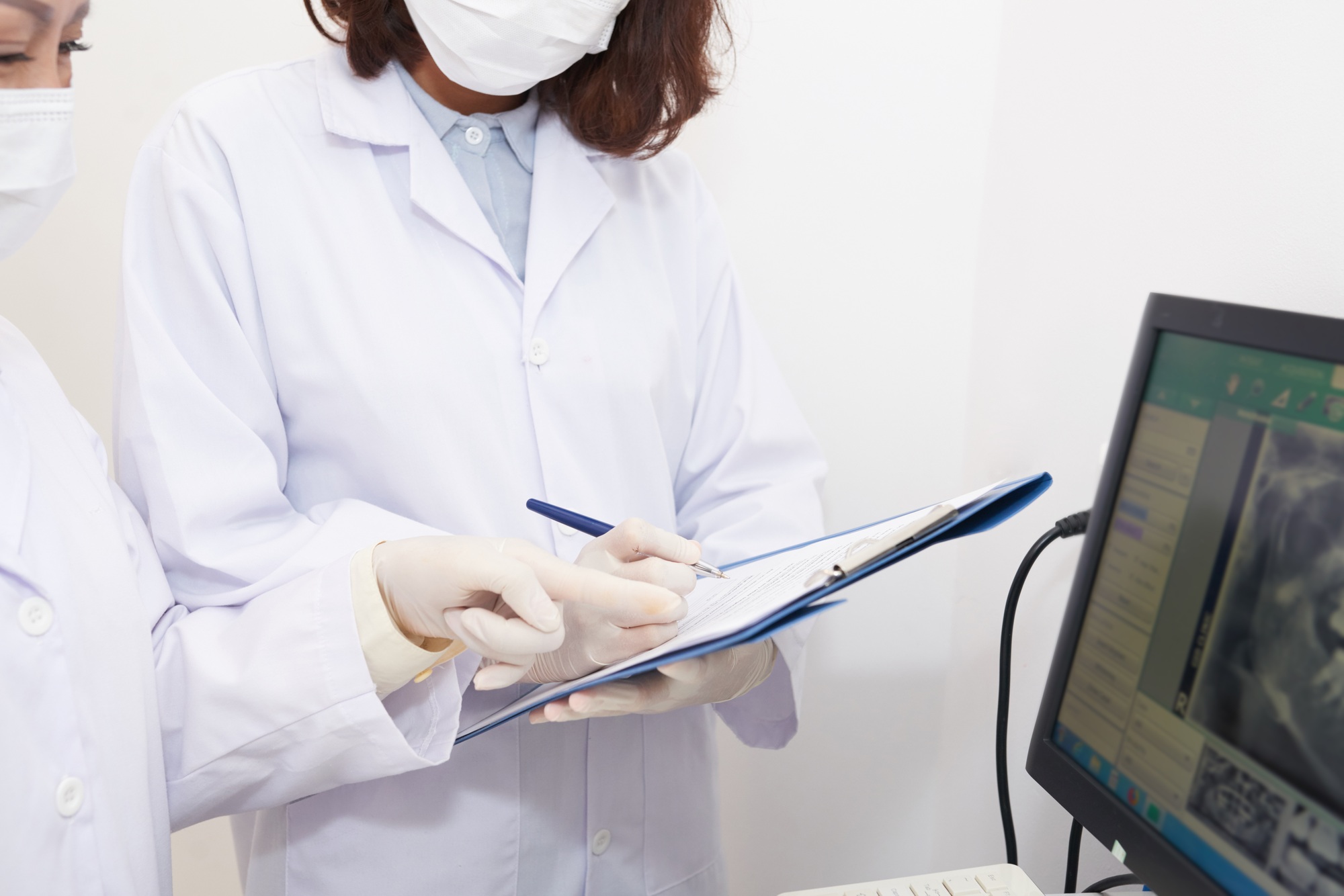 Crop assistant taking notes of dental x-ray